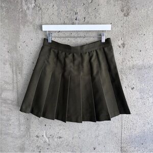 Olive green pleated mini skirt by Los Angeles Apparel